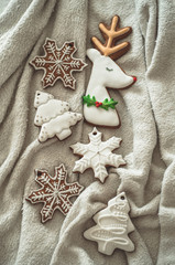 Tasty Christmas cookies on white plaid