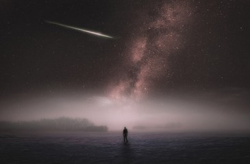 Dreamy surreal landscape with starry night sky and man silhouette