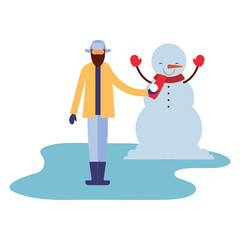 man with snowman in the winter season
