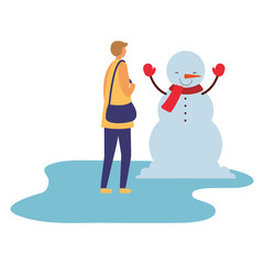 man with snowman in the winter season