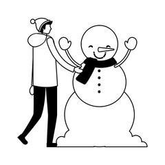 man with winter clothes and snowman