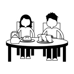 boy and girl eating breakfast