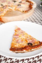 Italian pizza with ham olives and mushrooms