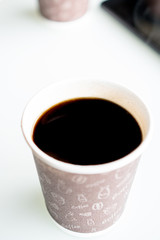 Paper cup of coffee  on bright background