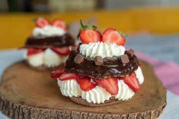 Chocolate pavlova with fresh strawberries and whipped cream