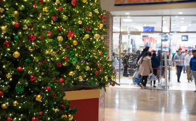 A beautiful Christmas tree greets visitors to a busy mall.