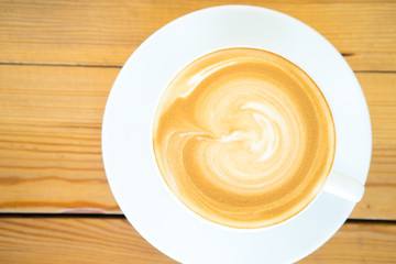 Hot coffee cup on wooden table