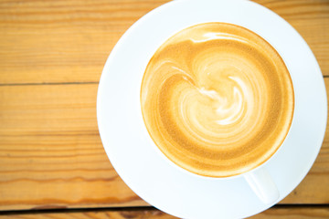 Hot coffee cup on wooden table