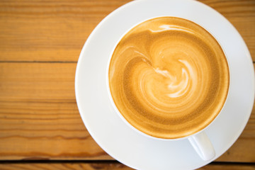 Hot coffee cup on wooden table