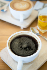 Hot coffee cup on wooden table