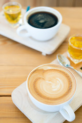 Hot coffee cup on wooden table