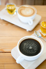 Hot coffee cup on wooden table