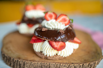 Chocolate pavlova with fresh strawberries and whipped cream