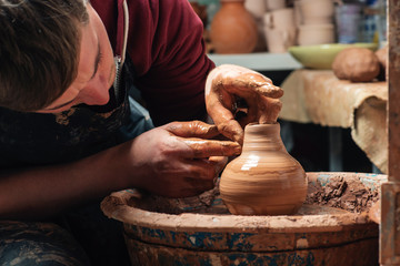 Potter at work. Workshop place.