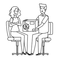 business couple sitting in chairs giving gift