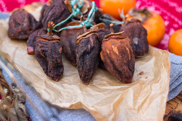 Sweet dried persimmons. Homemade and sun dried asian Japanese fruit. Healthy organic dessert