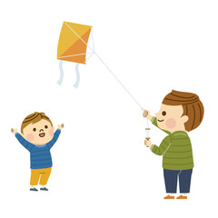 凧揚げをする親子