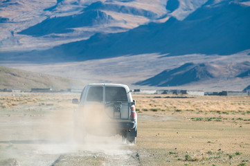 Driving a 4WD across country road in Tibet, China