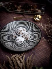 Healthy organic date energy balls with coconut flakes, dried fruits and nuts. Food for healthy lifestyle.
