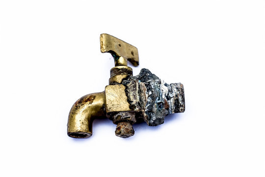 Close up of water tap of Brass i.e. Pital isolated on white.