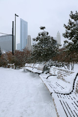 Christmas in Chicago. Modern architecture and cityscape background. Beautiful winter day in Chicago downtown. Scenic view in a city park with skyscrapers in at the background. Illinois, Midwest USA.