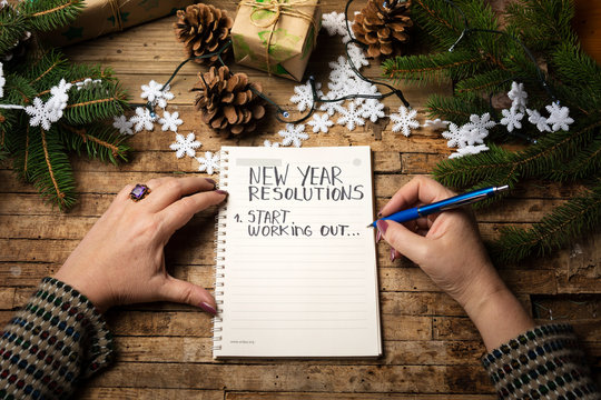 Woman Writing New Year Resolution List