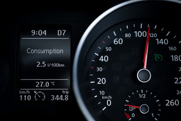 A Modern Car odometer Cluster with LCD Multifunction Display. Meter at constant speed show the fuel...