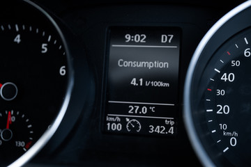 A Modern Car odometer Cluster with LCD Multifunction Display. Meter at constant speed show the fuel consumption efficiency 