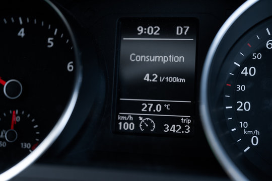 A Modern Car odometer Cluster with LCD Multifunction Display. Meter at constant speed show the fuel consumption efficiency 