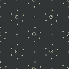 Simple abstract hand drawn tan dotted flowers on a black background. This neutral seamless vector pattern is perfect for textiles, fashion, gift wrapping paper, wallpaper and scrapbooking.