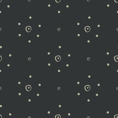 Simple abstract hand drawn tan dotted flowers on a black background. This neutral seamless vector pattern is perfect for textiles, fashion, gift wrapping paper, wallpaper and scrapbooking.