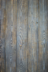 Background of natural wooden textured boards with traces of gray paint.