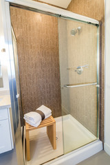 Luxury bright bathroom with a shower cabin. Interior design.