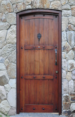 classic wood door with natural stone background