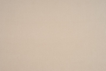 close up of a woolen fabric of beige color.
