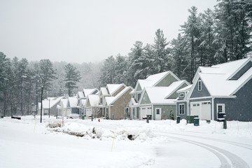 houses in residential community after snow in winter 