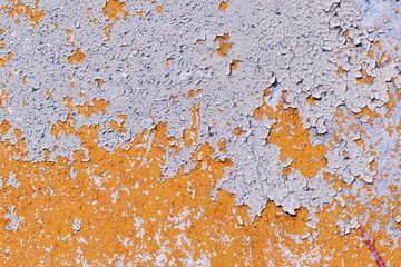 light coloured orange peeling paint on the old rough concrete surface