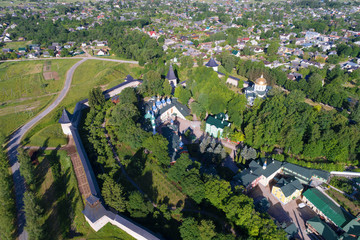 Over Holy Dormition Pskov-Caves Monastery in the sunny June afternoon (shooting from the quadcopter). Pechory, Russia