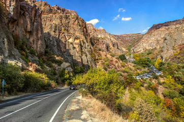 Fototapeta na wymiar Road to the monastery of Geghard through the rocks in the mountains of Geghama ridge in Armenia