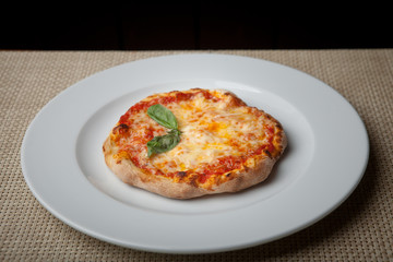 cheese pizza on a white plate