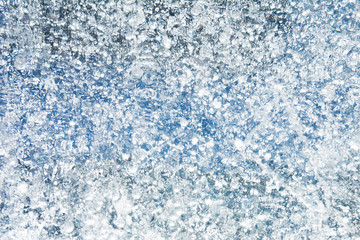 Fototapeta na wymiar The texture of the ice. The frozen water.Winter background 