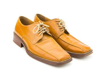 Men's autumn shoes made of genuine brown leather with laces on an isolated background. Classic shoes 