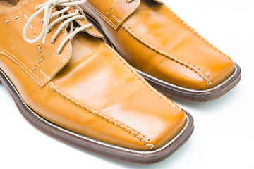 Men's autumn shoes made of genuine brown leather with laces on an isolated background. Classic shoes 