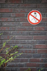 prohibition sign forbidding peeing in public on wall