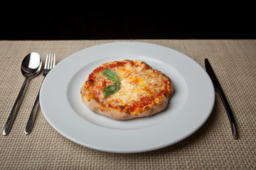 cheese pizza on a white plate