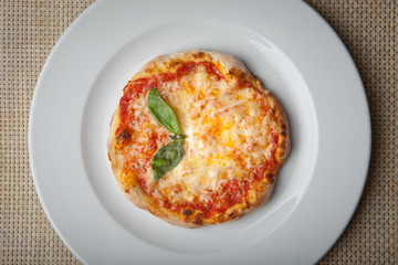 cheese pizza on a white plate