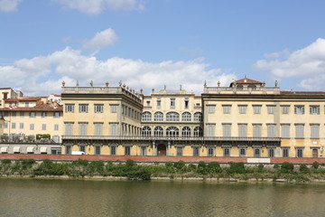 Fototapeta na wymiar Cityscape view on the riverside with the old buildings and palaces (Florence Italy)