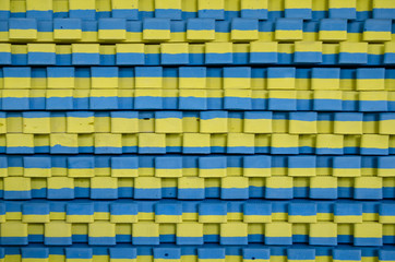 Fototapeta premium blue-yellow sports mats stacked in large stack
