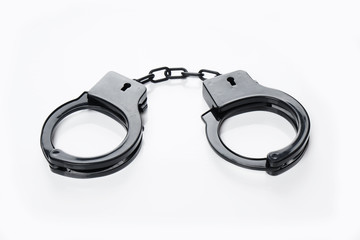 black plastic handcuffs sex toy on white background                         