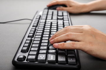 hands on a computer keyboard